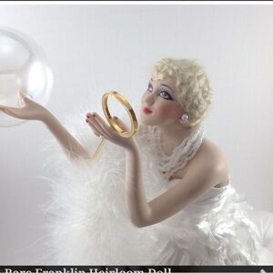 Elegant Porcelain Doll with Feathered Dress